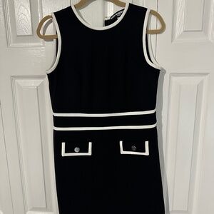 Black sleeveless dress with white trim